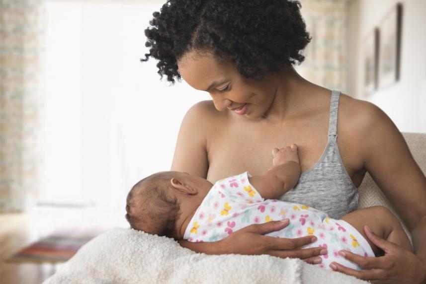 A mom breastfeeding her infant