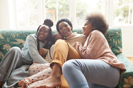 Mother and daughters hugging